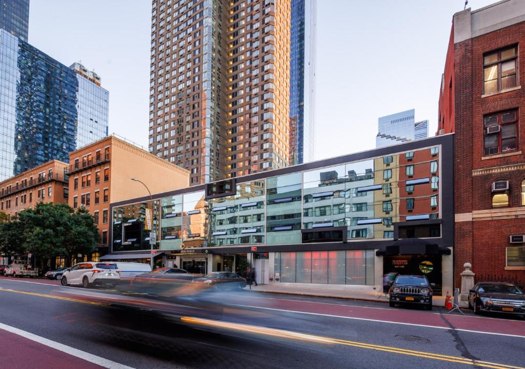 Urban building with glass facade and tall towers