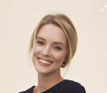 a smiling woman with blond hair